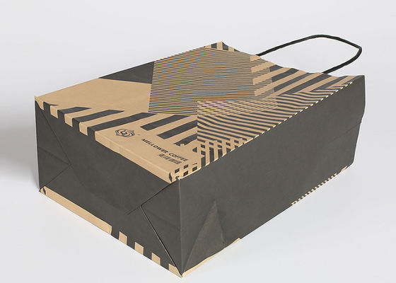 Los bolsos de compras reutilizables de Kraft, forman las bolsas de papel rayadas con las manijas